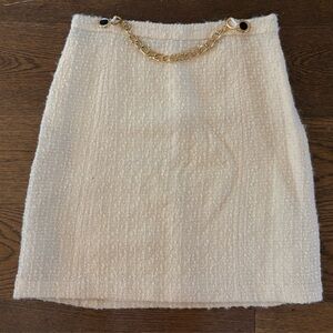 Original Milly of New York wool miniskirt  Gold chain, black button detail.